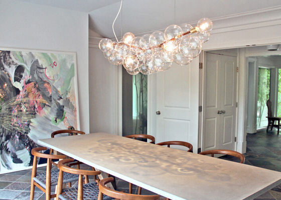 La luce di lampadine di vetro mette insieme i candelieri dell'hotel decorativi con il vostro modo per sala da pranzo